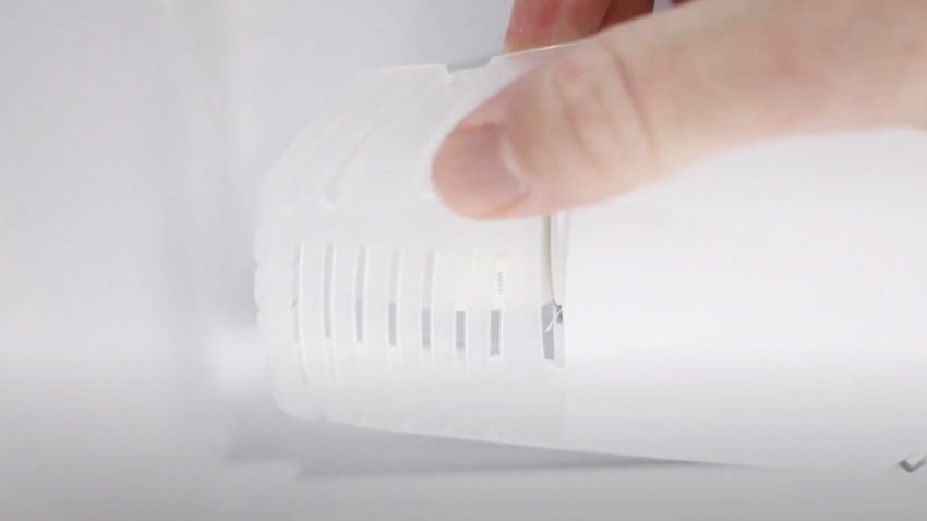 Remove bulb cover from fridge freezer